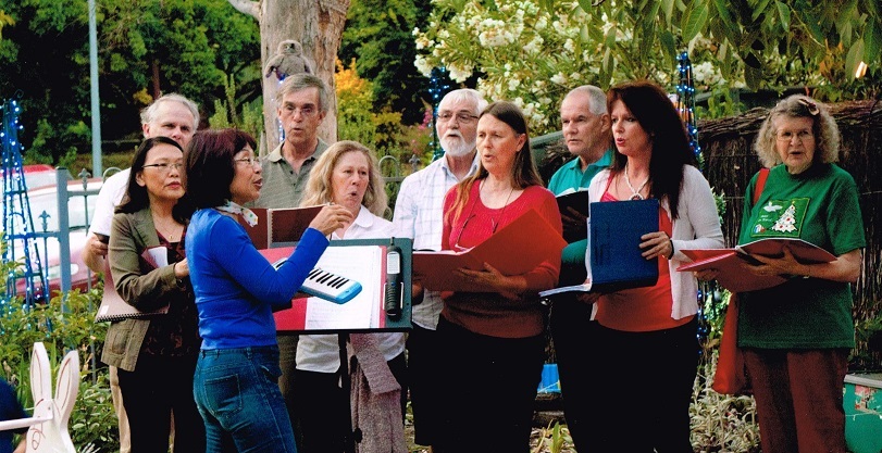Photo of the Spence Community Choir carol singing